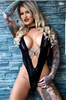 blonde female striptease artist with big boobs in super tight outfit in wollongong